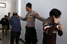 sex men indonesia gay having caning two indonesian people sentenced other each courtroom party sharia asia police court being trial