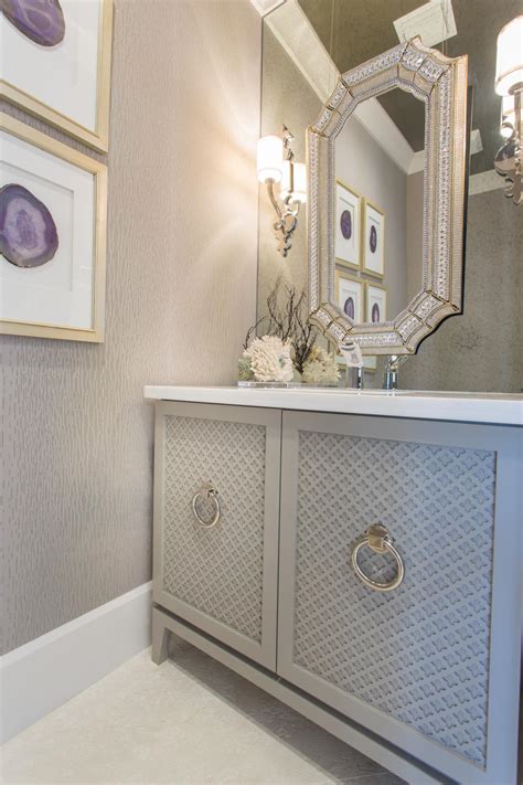 It has the elements of artistry, chic and class. Elegant Gray Powder Room | HGTV