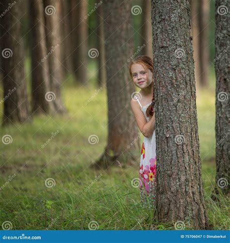 Two Girls Having Fun Posing Near A Rustic Wooden Fence Stock Image