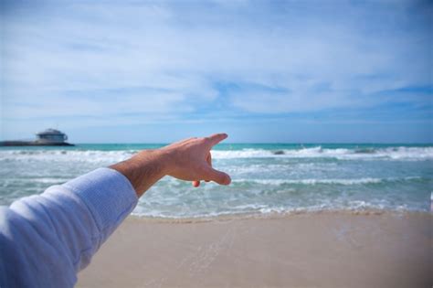 Premium Photo Man Pointing To The Sea