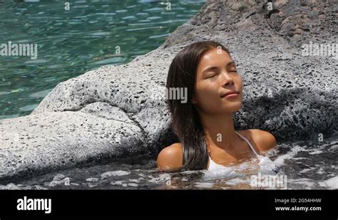 spa wellness woman relaxing in hot tub whirlpool jacuzzi at resort stock video footage alamy