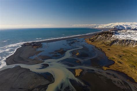 Aerial View Of Patterns Of Icelandic Rivers Flowing Into The Ocean