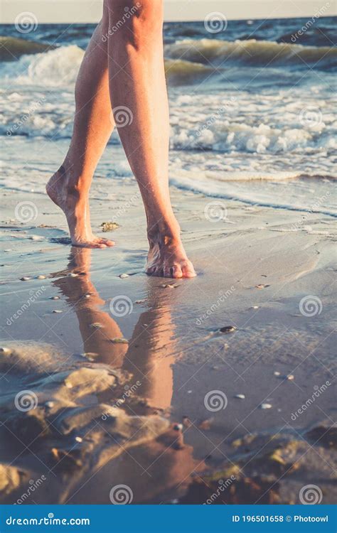 Close Up View To Female Feet Reflection In The Water Barefoot Young