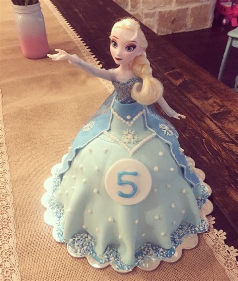 A perfect gift for friends, kids and anyone who loves princess my daughter won't let the doll go. Elsa doll cake. Fondant/buttercream frosting. Made with ...