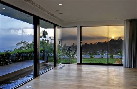 This style with wide windows also can. How to Decorate a Room with Floor-to-Ceiling Windows