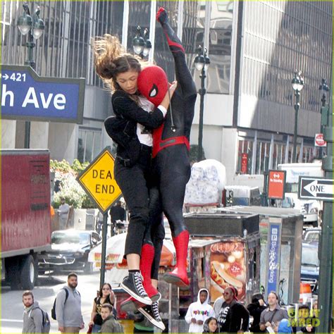 zendaya holds onto tom holland while shooting spider man far from home photo 1192350