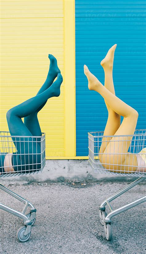 Two Female Friends In Front Of A Blue Yellow Wall By Stocksy Contributor Jovana Rikalo Stocksy