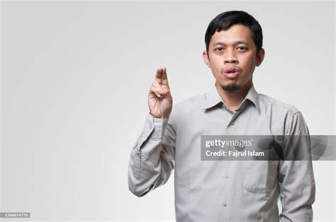 Young Men Gesturing Sign Language High Res Stock Photo Getty Images