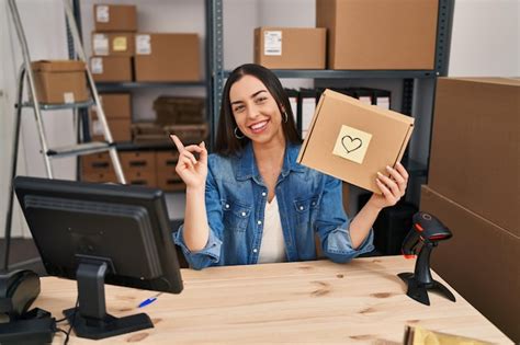 Premium Photo Hispanic Woman Working At Small Business Ecommerce Holding Box Smiling Happy