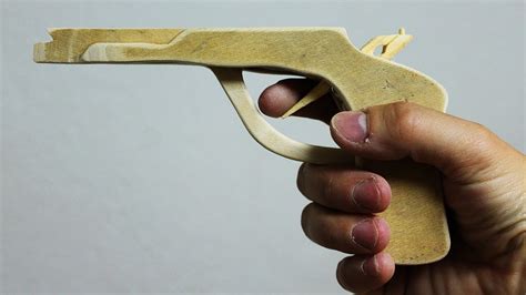 It's not a lot, but better than 1.make. How to make a Wooden Gun that shoots - DIY Rubber Band Gun - YouTube