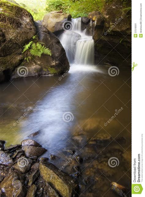 Vertical Photo Of A Beautiful Waterfall On A Mountain River Stock Image