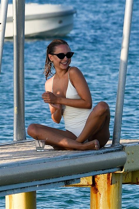 Kimberley Garner Wears A White Swimsuit As She Hits The Beach In Saint