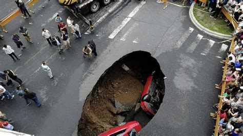 Massive Sinkhole Swallows Two Cars With Three People Inside News