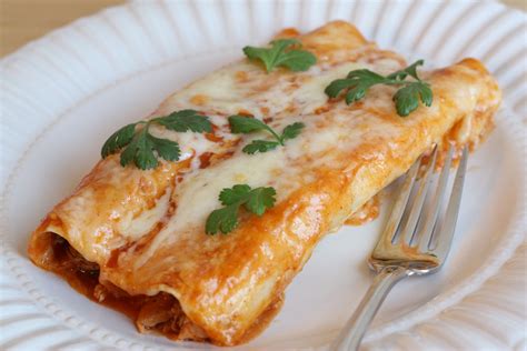 One by one, dip a tortilla in the enchilada sauce and place in a 9x13 pyrex baking dish. That Winsome Girl: Chicken Enchiladas