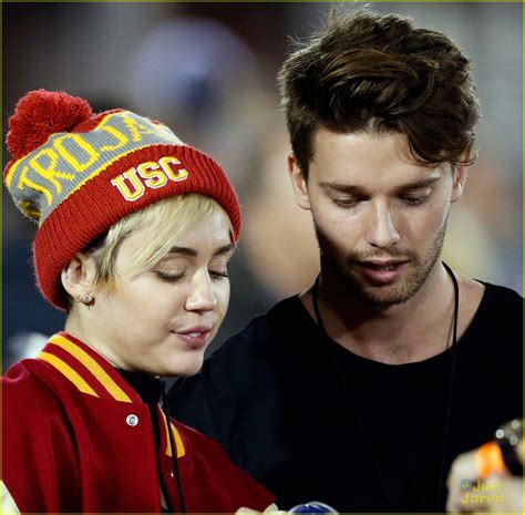 Miley Cyrus Patrick Schwarzenegger Kiss At Usc Football Game See The Pics Photo