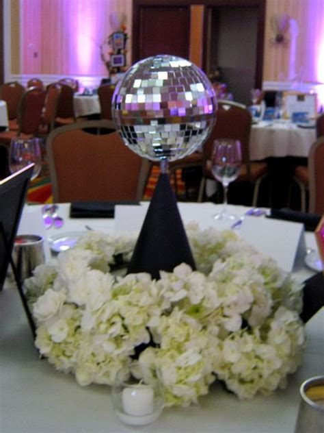 To help you and your guests lose yourself in the frivolous decade, we bring to you plenty of disco theme décor ideas and plans. 70s Theme Centerpiece | 70s party decorations, 70s party ...