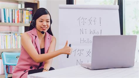Asian Woman Teacher Teaching Remotely At Home Office With Online