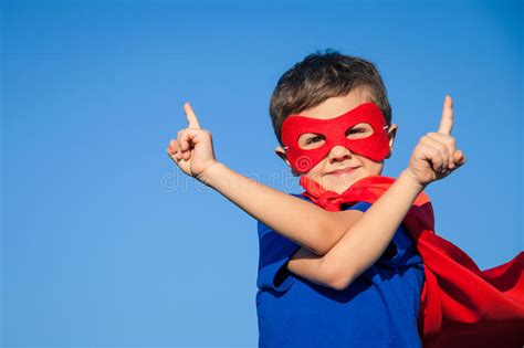 Superhero Child Flying Above The Clouds Stock Photo Image Of