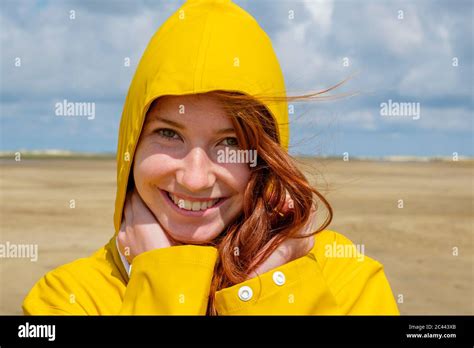 Yellow Hood Raincoat Hi Res Stock Photography And Images Alamy