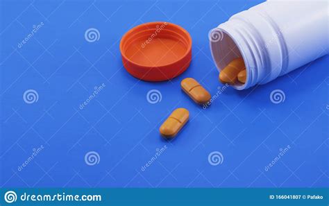 Orange Medical Pills And Tablets Spilling Out Of A Drug Bottle Stock