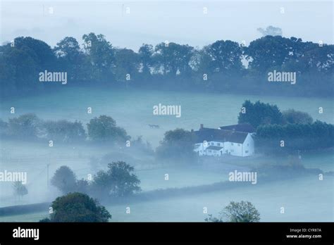 House In Mist Uk Stock Photo Alamy