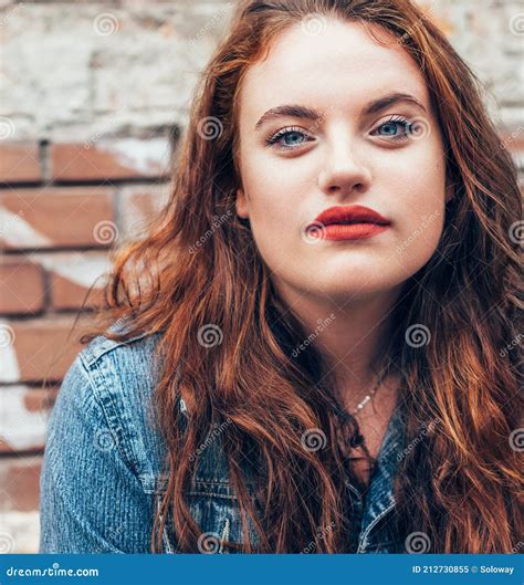 Red Curled Hair Caucasian Teen Girl With Applied Red Lipstick Lips With