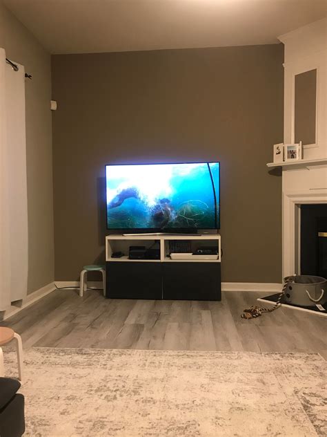 What should I put on the wall behind the tv to give it some height ...