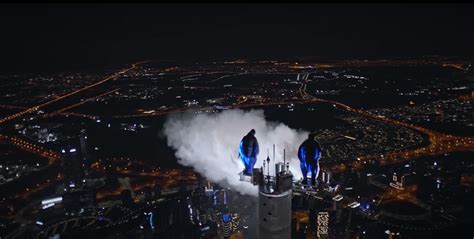 Wingsuit Base Jumping From The Top Of Dubais Burj Khalifa At Night