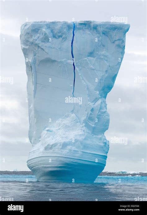 Iceberg Amongst The Ice Floe In The Southern Ocean 180 Miles North Of