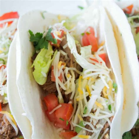 Easy Slow Cooker Mexican Shredded Beef Tacos With Avocado Crema