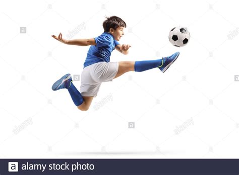 Kid Kicking Soccer Ball Isolated High Resolution Stock Photography And