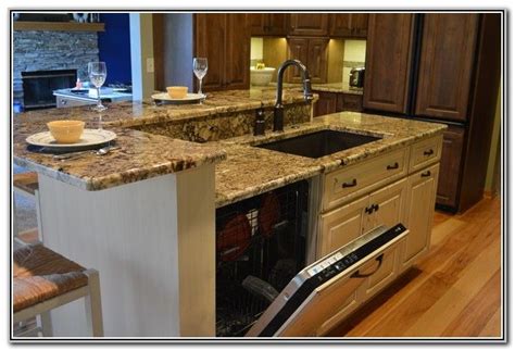 Jun 07, 2021 · a large sink in a kitchen island might be a little controversial, but is a great solution if you're struggling for space and looking for smaller kitchen ideas. kitchen island with sink and dishwasher and seating ...