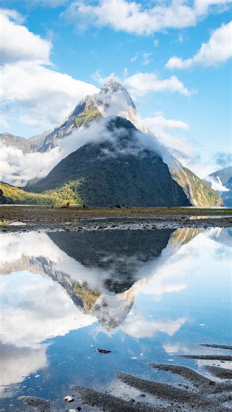Download Wallpaper 1080x1920 Mountains Peaks Lake Reflection Clouds