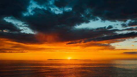 Download 1366x768 wallpaper sea, clouds, horizon, clam sea, sunset ...