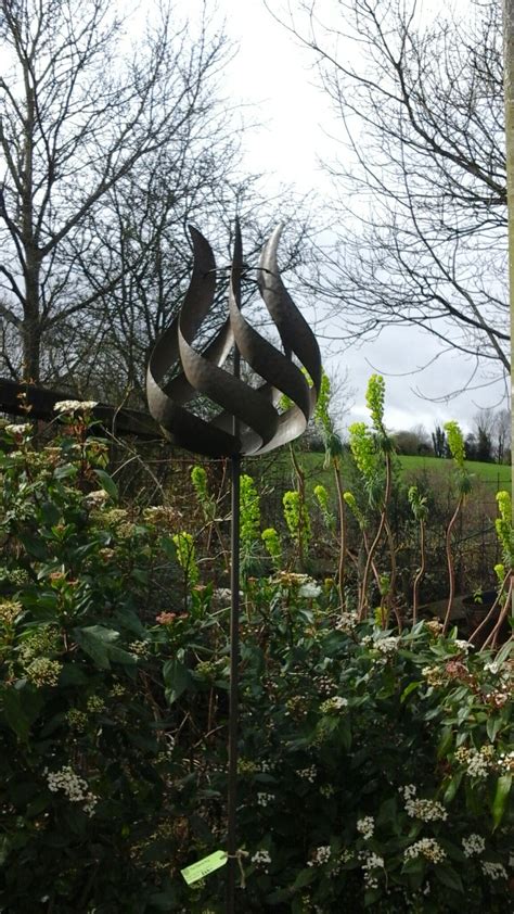 Elegant Tulip Shaped Garden Sculpture Wind Spinner Available From The