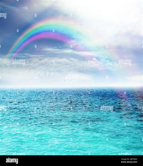 Ocean Water And Beautiful Rainbow In Sky Stock Photo Alamy