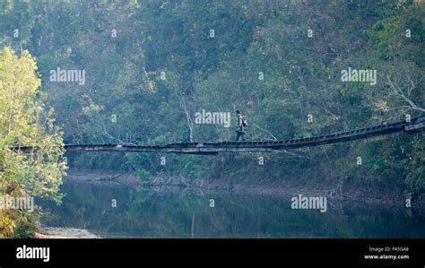 Nature Guide Crossing A Wooden Bridge In Nepal Stock Photo Alamy
