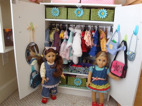 Two Dolls Standing Next To Each Other In A Closet