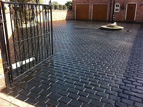 Can anyone advise the easiest way of covering a concrete driveway? driveway-black-cobble-manchester - Pattern Imprinted ...