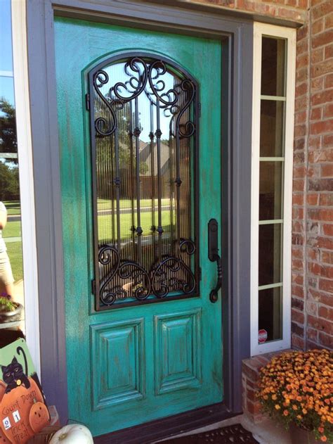 Another idea is to use a hanging your wreath from a shutter adds so much texture and ambiance. THIS IS MY SIS' DOOR !Turquoise doors in 2019 | Turquoise door, Teal front doors, Doors