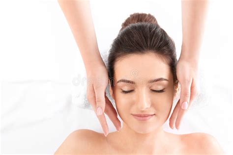 Young Woman Receiving Face Massage On White Background Top View Spa Procedures Stock Image