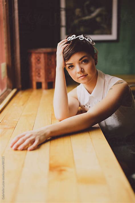 Girl Sitting At A Wine Bar By A Window By Gabrielle Lutze Stocksy United