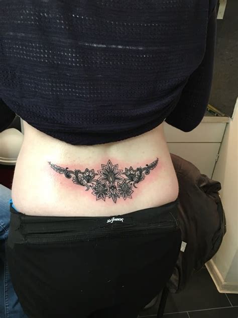 25 cute lower back flower tattoos for girls