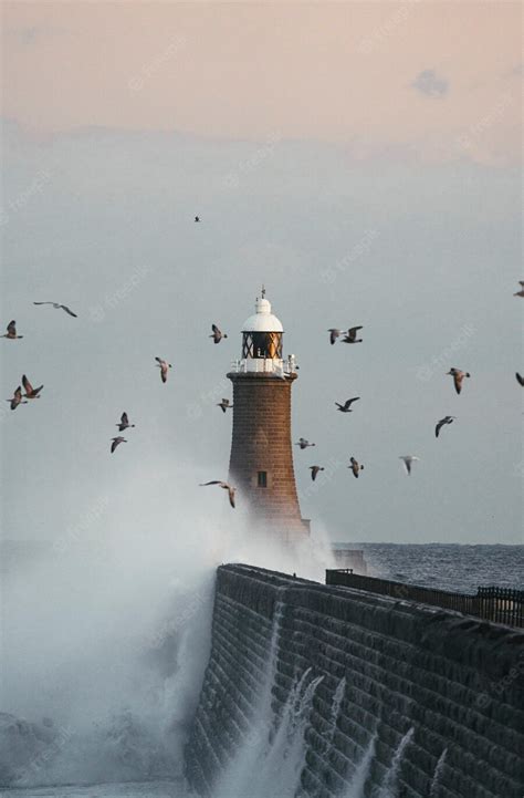 Premium Photo Huge Wave Hitting A Lighthouse In Scotland