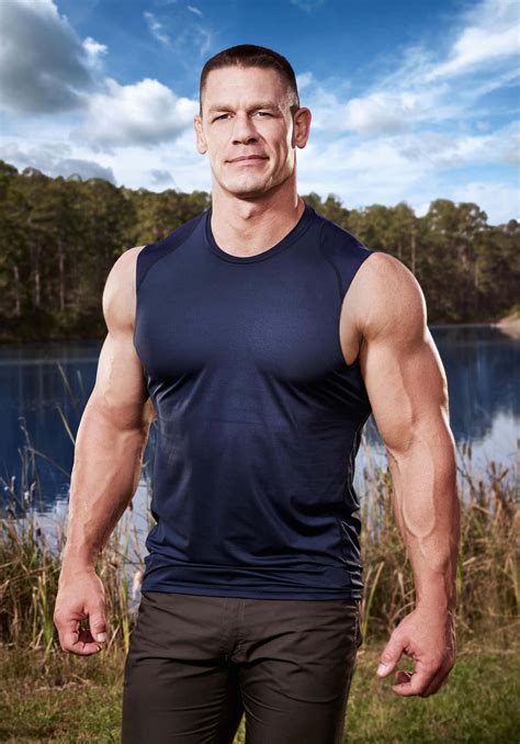 Download John Cena Flexing His Biceps With A Triumphant Smile