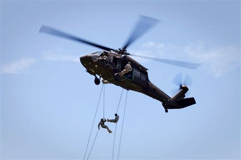 Soldiers And Army Cadets Rappel Out Of A Uh 60 Black Hawk Helicopter
