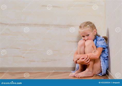 Sad Young Girl Sitting In Corner Stock Photo Image Of Child Alone