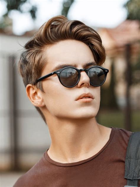 The back and sides of the hair are cut extremely short. 11 Cool Curly Hairstyles For Men - Men's Hairstyle Trends