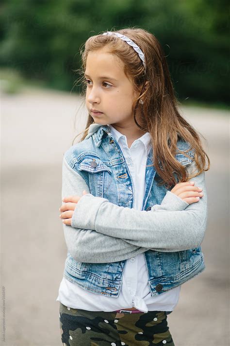 Portrait Of A Cute Young Girl In A Hooded Denim Jacket Del