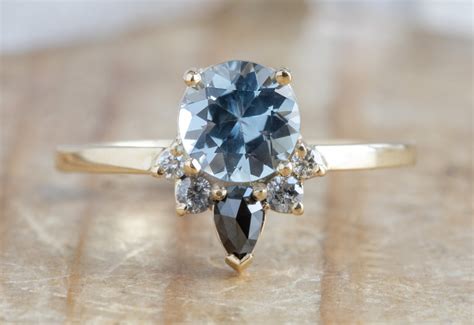Light Blue Sapphire Engagement Ring With Diamond Sunburst And Alexis Russell